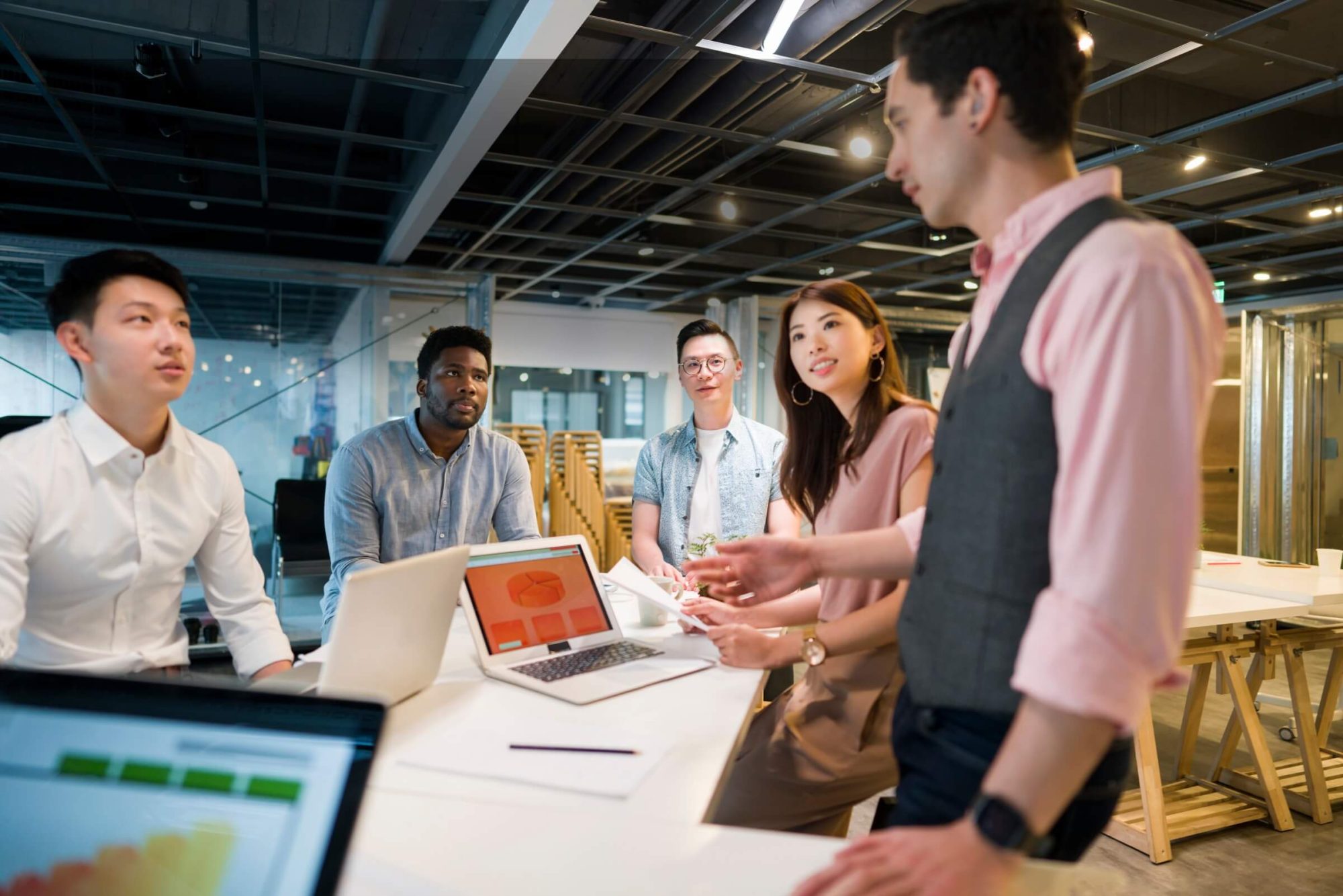 Leadership team discussing project planning and delivery