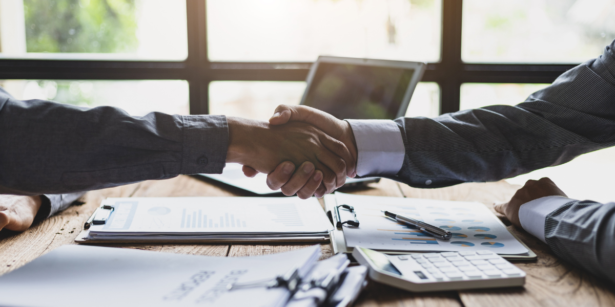 Client meeting showing an accountant discussing work without a degree