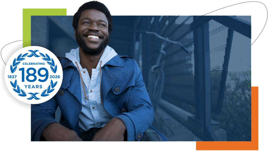 Working professional smiling during a discussion in a modern office